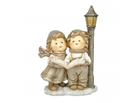 Niños navideños pareja cantores